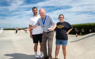 Southwold Mayor Simon Flunder tries out a skateboard with Olympian Robbie Grabarz and Klondyke Skatepark fundraiser Melanie Wilson. Picture: Rob Howarth Photography