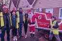 Santa and his sleigh visiting people in and around Dereham