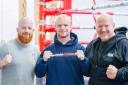 Mikie Webber-Kane with trainers Tony Norman, left, and Graham Everett