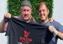 Owner of Jus' Winging It Joe Pybus (right) with the first winner of the 'Wing Sting' challenge Damien