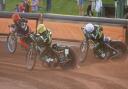 Danny King and Jason Crump chasing Nick Morris in heat five.