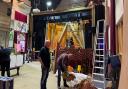 Theatre volunteers dismantling the temporary door partition immediately after the show run of Joseph in preparation for the installation of the new doors at the Players Theatre.