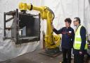 Robot Programmer at Round House Ltd Sean Sullivan demonstrates an industrial robot to Waveney MP Peter Aldous. Picture: Mick Howes