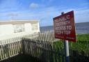 People have been evacuated from caravans after a coastal road collapsed into the sea