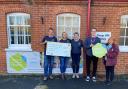 The funds are handed over to the hospice charity