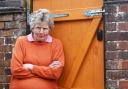 Gillian Mears pictured next to her back gate which she spent £520 to have repaired after youths smashed it up, twice