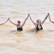 Callum Gale, Tasmin Humphrey, Tilly Davies, Miles Fowler enjoy the sunshine and a dip at Southwold beach.