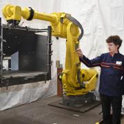 Robot Programmer at Round House Ltd Sean Sullivan demonstrates an industrial robot to Waveney MP Peter Aldous. Picture: Mick Howes