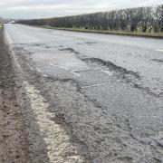 A pothole in a road in Long Melford