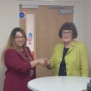 The new Mayor of Lowestoft Cllr Nasima Begum (left) receives the mayoral chain from the outgoing Mayor Cllr Sonia Barker (right). Picture: Lowestoft Town Council