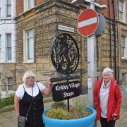 Wendy Dalton and Jacqui Hardie at the no entry sign on Waterloo Road in Kirkley, Lowestoft with one of the covered up arrows that previously pointed the way to the village shops - until a complaint was lodged. Picture: Mick Howes