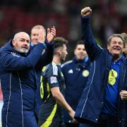 Steve Clarke, left, celebrates a memorable win (PA)